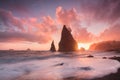 Coastline with sea stacks in sunset time with red and purple light. Rialto Beach in Olympic National Park, Olympic Peninsula, USA. Royalty Free Stock Photo