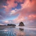 Coastline with sea stacks in sunset time with red and purple light. Rialto Beach in Olympic National Park, Olympic Peninsula, USA. Royalty Free Stock Photo