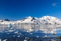 Coastline with stones and cold still waters of antarctic sea lag Royalty Free Stock Photo