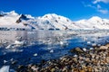 Coastline with stones and cold still waters of antarctic sea lag Royalty Free Stock Photo