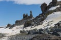 Coastline with stones and ice, sea lagoon with mountains with colony of antarctica chinstrap penguin. Half Moon island