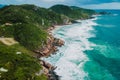 Coastline with stormy ocean and scenic cloudy sky. Aerial view with mountains and ocean with waves Royalty Free Stock Photo