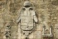 Coat of arms depicted at the exterior wall of the Ozama fortress in Santo Domingo, Dominican Republic. Royalty Free Stock Photo