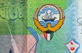 The coat of arms and flag of Kuwait closeup from the obverse side of Kuwaiti half dinar green paper banknote cash money bill