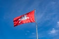 The coat of arms of Lithuania. State lithuanian flag. Knight on a horse on a red background on blue sky Royalty Free Stock Photo