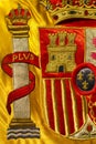 Coat of arms of Spain nation richly embroidered on its flag