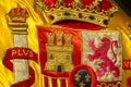 Coat of arms of Spain nation richly embroidered on its flag