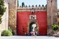 Coat of arms of the Spanish king Pedro I over the Lion's Gate to Alcazar Gardens Royalty Free Stock Photo