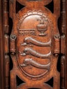 Coat of arms with three fish made of wood