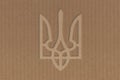 Coat of arms of ukraine cut out on cardboard Royalty Free Stock Photo