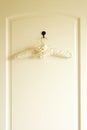Coat Hanger On Back Of Door Royalty Free Stock Photo