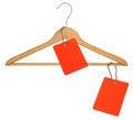 Coat hanger and two blank price tags Royalty Free Stock Photo