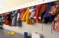 Coat rack in a nursery with a lot of chidren coats