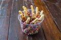 Coated chocolate bread with Colorful sugar crystals on a wooden