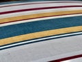 Coating of Time: Rows of Colorful Stripes on a Vintage Cloth with Subtle Grooves
