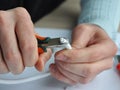 Coaxial cable to transmit satellite signals in hand. Closeup cable repair.