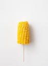 The cob boiled corn on a stick on white background Royalty Free Stock Photo