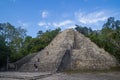 Turists climbing on Nohoch Mul Pyramid in Coba