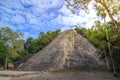 Tourists at ruins of Nohoch Mul Pyramid in Coba ancient Mayan city, Yucatan Mexico