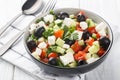 Coban salatasi or shepherd salad is a simple side salad based on tomato and cucumber with peppers, onion, herbs and cheese closeup Royalty Free Stock Photo