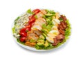 Cobb salad in a white salad bowl isolated on white background. Royalty Free Stock Photo