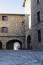 Cobble stones old medieval building facade on a medieval traditional old rural townscape in Bellver de Cerdanya, Catalonia