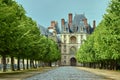 A cobbled alley in a park around the Fontainebleau Palace