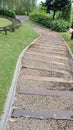 cobbled path in a beautiful green garden Royalty Free Stock Photo