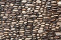 Cobbled pavement made of river rounded pebbles. Background texture. Royalty Free Stock Photo