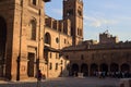 Cobbled square and side of San Andrea church with its bell tower at sunset