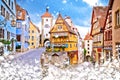 Cobbled street and architecture of historic town of Rothenburg ob der Tauber winter snow view Royalty Free Stock Photo