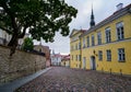 Cobbled street in the city of Tallinn at sunrise.