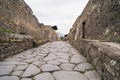 Cobbled street in excavated town of Pompeii, Italy