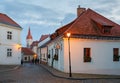 Cobbled street in the historical downtown on a winter evening. Town of Znojmo, Czech Republic. Royalty Free Stock Photo