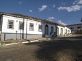 Cobbled street lined with colonial houses