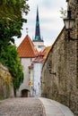 Cobbled street next to the stone walls of the city of Tallinn Royalty Free Stock Photo
