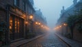 Cobbled streets with old lanterns illuminating the thin mist Royalty Free Stock Photo