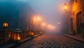 Cobbled streets with old lanterns illuminating the thin mist Royalty Free Stock Photo