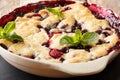 Cobbler mix of currants, raspberries and blueberries decorated w Royalty Free Stock Photo