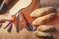 Cobbler tools in workshop on the wooden table . Top view.