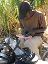 Cobbler working on roadside in Zimbabwe.