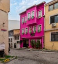Cobblestone alley, with beautiful old houses painted in pink and yellow, suited in Fatih district, Istanbul