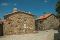 Cobblestone alley on slope and old stone houses Royalty Free Stock Photo