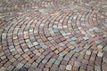 Cobblestone of porphyry cubes, sanpietrini, typical urban paving in a square in Italy