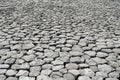 Cobblestone background with uneven natural stone