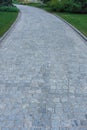 Cobblestone concrete paver estate entryway.