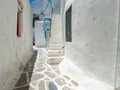 Cobblestone narrow alley whitewashed houses Mykonos island Cyclades Greece