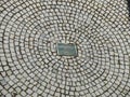 Cobblestone pavement radial pattern with sinkhole Royalty Free Stock Photo