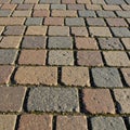 Cobblestone pavement with square bricks in Earth tones of brown Royalty Free Stock Photo