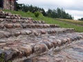 Cobblestone staircase placed at the entrance to the house. Porch and steps of the old mansion Royalty Free Stock Photo